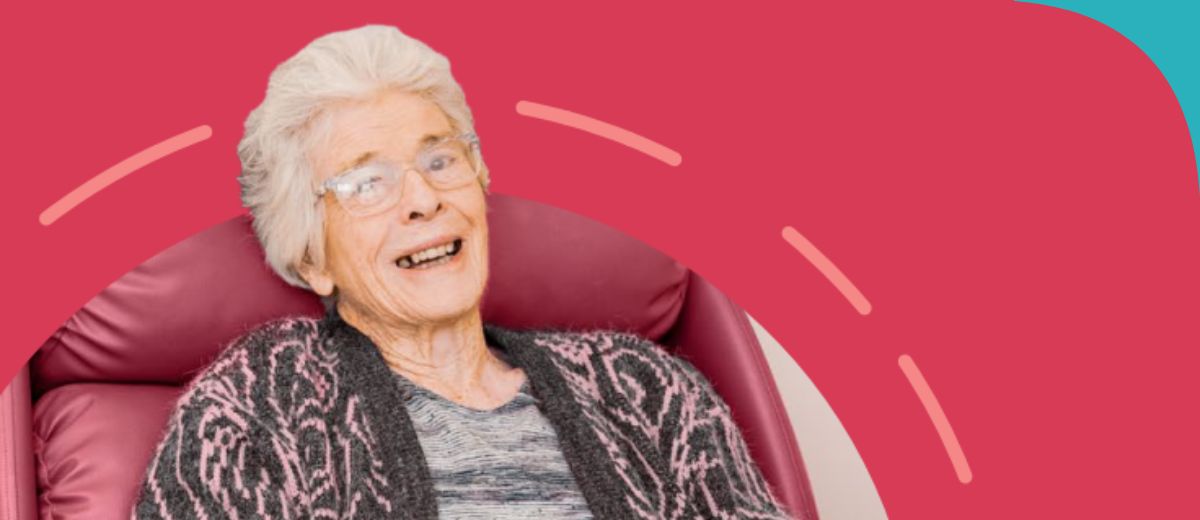 A lady sitting in a red chair